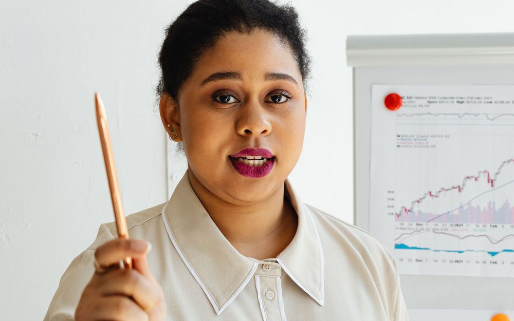 A consultant presenting financial charts — the kind of cloud cost review that starts the conversation